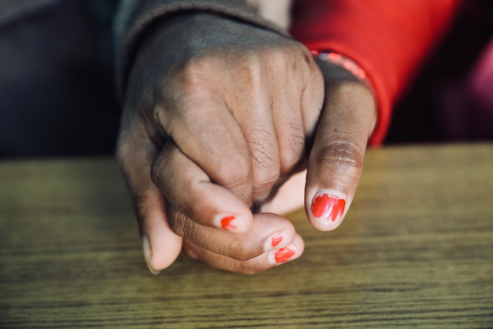 Devna and Sejun hold hands awaiting a medical abortion at the FPAN Central Clinic in Nepal.