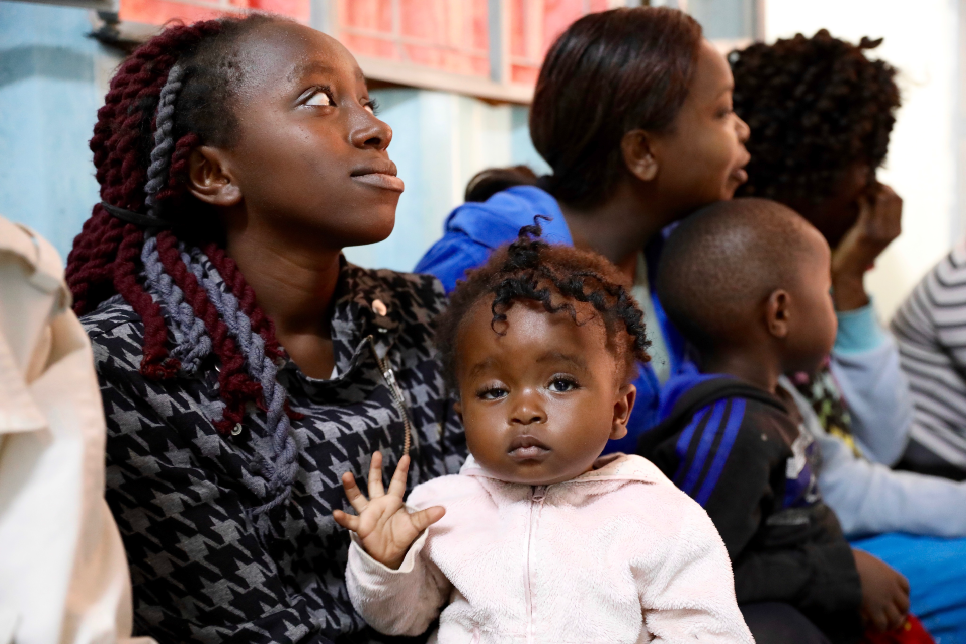 Mary-Kimenmia with her child.